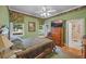 Cozy bedroom features green walls, floral accents, and natural light from the window at 240 Rose Ridge Dr, Canton, GA 30115