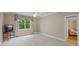 Spacious bedroom features a large window with backyard views and neutral carpet at 240 Rose Ridge Dr, Canton, GA 30115