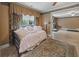 Comfortable bedroom with patterned rug, daybed and access to the home gym area at 240 Rose Ridge Dr, Canton, GA 30115