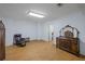 Bonus room featuring a wooden floor, antique furniture, and great lighting at 240 Rose Ridge Dr, Canton, GA 30115