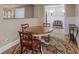 Dining area features a round table, four chairs and a decorative area rug at 240 Rose Ridge Dr, Canton, GA 30115