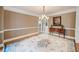 Formal dining room with hardwood floors and a decorative chandelier at 240 Rose Ridge Dr, Canton, GA 30115