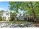Charming home with a lush landscaped front yard and stone walkway at 240 Rose Ridge Dr, Canton, GA 30115