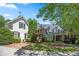 Charming home with a lush landscaped front yard and stone walkway at 240 Rose Ridge Dr, Canton, GA 30115