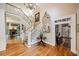 Elegant foyer with hardwood floors and a grand staircase at 240 Rose Ridge Dr, Canton, GA 30115