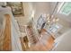 Grand foyer entrance featuring a chandelier, staircase with decorative carpet, and hardwood floors at 240 Rose Ridge Dr, Canton, GA 30115