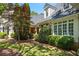 Beautifully landscaped yard with mature trees and shrubbery enhancing the home's curb appeal at 240 Rose Ridge Dr, Canton, GA 30115