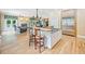 Open kitchen design with a breakfast bar, stone countertops, and stainless steel appliances at 240 Rose Ridge Dr, Canton, GA 30115