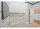Functional laundry area with white cabinets, patterned wallpaper, and a utility hookup at 240 Rose Ridge Dr, Canton, GA 30115