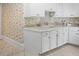 Practical laundry room with white cabinetry, utility sink, and neutral countertops at 240 Rose Ridge Dr, Canton, GA 30115