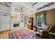Cozy living room featuring a fireplace, custom built-ins, and a coffered ceiling at 240 Rose Ridge Dr, Canton, GA 30115