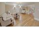 Upstairs sitting room featuring hardwood floors, elegant sofas and natural light at 240 Rose Ridge Dr, Canton, GA 30115