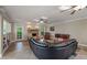 Spacious living room with stone fireplace and seamless access to an outdoor patio at 240 Rose Ridge Dr, Canton, GA 30115