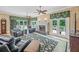 Comfortable living room featuring a fireplace, plush seating, and access to the outdoor deck at 240 Rose Ridge Dr, Canton, GA 30115