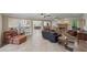 Large open living space with stone fireplace, tiled floors and open to kitchen at 240 Rose Ridge Dr, Canton, GA 30115