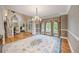 Formal living room with hardwood floors and a decorative chandelier at 240 Rose Ridge Dr, Canton, GA 30115