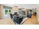 Spacious living room with a fireplace, hardwood floors, and french doors leading to outdoor space at 240 Rose Ridge Dr, Canton, GA 30115