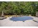 Inviting pool area surrounded by lush greenery, lounge seating, and tranquil ambiance at 240 Rose Ridge Dr, Canton, GA 30115