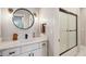 Stylish bathroom featuring a modern vanity with chrome accents and a glass-enclosed shower at 2721 Old Concord Se Rd, Smyrna, GA 30082