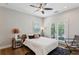 Cozy bedroom features a ceiling fan and private access to outdoor living at 2721 Old Concord Se Rd, Smyrna, GA 30082