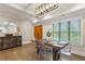 Bright dining room with a wooden table, decorative buffet, and windows bringing the outside in at 2721 Old Concord Se Rd, Smyrna, GA 30082