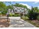 Charming home with a manicured lawn and iron fence at 2721 Old Concord Se Rd, Smyrna, GA 30082