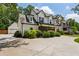 Beautiful two-story home with a large driveway and mature landscaping at 2721 Old Concord Se Rd, Smyrna, GA 30082