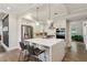 Modern kitchen with white cabinets, stainless steel appliances, an island, and pendant lighting at 2721 Old Concord Se Rd, Smyrna, GA 30082