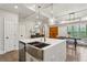 Bright eat-in kitchen featuring stainless steel appliances, island with breakfast bar, and pendant lighting at 2721 Old Concord Se Rd, Smyrna, GA 30082