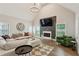 Inviting living room featuring vaulted ceilings, fireplace, hardwood floors, and plenty of natural light at 2721 Old Concord Se Rd, Smyrna, GA 30082