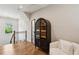 Loft area featuring wood floors, white couch and a glass case at 2721 Old Concord Se Rd, Smyrna, GA 30082