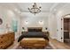 Serene bedroom retreat with hardwood floors, tray ceiling, natural light, and rustic wood furnishings at 2721 Old Concord Se Rd, Smyrna, GA 30082