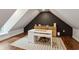 Attic office space with wood floors and a white desk at 2721 Old Concord Se Rd, Smyrna, GA 30082