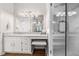 Well-lit bathroom with tiled shower, white vanity, and modern fixtures at 5245 Chemin De Vie, Atlanta, GA 30342