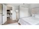 Cozy bedroom featuring a large closet, hardwood flooring, and a comfortable bed at 5245 Chemin De Vie, Atlanta, GA 30342