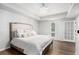 Serene bedroom with hardwood floors, a queen-sized bed, and abundant natural light at 5245 Chemin De Vie, Atlanta, GA 30342