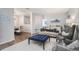 Bright living room featuring hardwood floors, modern furnishings, and neutral paint at 5245 Chemin De Vie, Atlanta, GA 30342