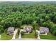 Aerial view of estate home surrounded by trees with generous lot size at 7493 Elderberry Dr, Douglasville, GA 30135