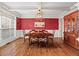 Formal dining room with hardwood floors, wainscoting, and coffered ceilings at 7493 Elderberry Dr, Douglasville, GA 30135