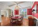 Elegant dining room with hardwood floors, large window, and sophisticated decor at 7493 Elderberry Dr, Douglasville, GA 30135
