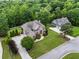 Lovely brick home on a well-manicured lot, featuring a long driveway and a beautifully landscaped yard at 7493 Elderberry Dr, Douglasville, GA 30135