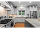 Updated kitchen features granite counters, stainless steel appliances and a large island at 7493 Elderberry Dr, Douglasville, GA 30135