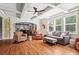 Comfortable living room with hardwood floors, coffered ceiling, large windows and natural light at 7493 Elderberry Dr, Douglasville, GA 30135