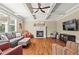 Spacious living room with coffered ceilings, fireplace, neutral colors, and hardwood floors at 7493 Elderberry Dr, Douglasville, GA 30135