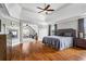 Spacious main bedroom with a fireplace, sitting area, and large windows with natural light at 7493 Elderberry Dr, Douglasville, GA 30135