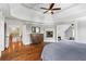 Expansive main bedroom with a fireplace, hardwood floors, and access to other rooms at 7493 Elderberry Dr, Douglasville, GA 30135