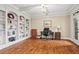 Spacious home office with custom built-in bookshelves and natural light at 7493 Elderberry Dr, Douglasville, GA 30135