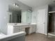 Primary bathroom featuring double vanity sinks, large mirror, and shower at 8850 Grappe Trace, Suwanee, GA 30024