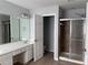 Bathroom featuring double vanity sinks, large mirror, and shower at 8850 Grappe Trace, Suwanee, GA 30024