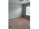 Bright bedroom with plush carpet, ceiling fan, and view of neighborhood at 8850 Grappe Trace, Suwanee, GA 30024